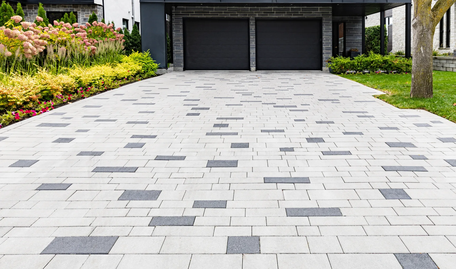 A clean, freshly restored block paving driveway